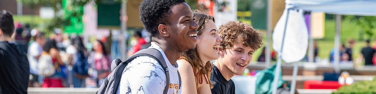 students laughing on campus